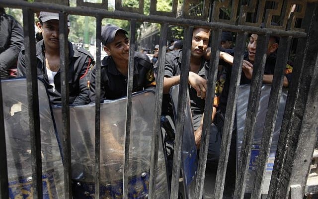 Anti-riot soldiers sit block the entrance of the Egyptian Parliament June 19 (photo credit: AP Photo/Amr Nabil) Anti-riot soldiers sit block the entrance of the Egyptian Parliament June 19 (photo credit: AP Photo/Amr Nabil)