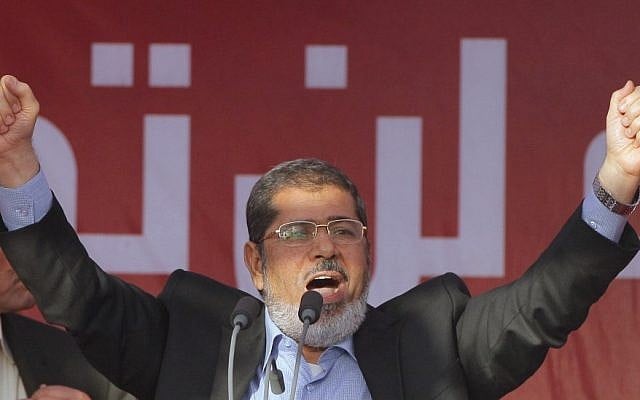 Egypt's President-elect Mohammed Morsi talks to his supporters at Tahrir Square, the focal point of Egyptian uprising. (photo credit: AP)