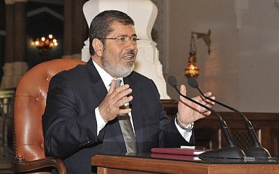 Egyptian President-elect Mohammed Morsi speaks to newspaper editors in Cairo on Thursday, June 28, 2012. (photo credit: Egyptian Presidency/AP)
