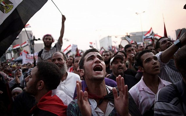 Egyptian protesters in Cairo's Tahrir Square in 2012. (photo credit: AP Photo/Manu Brabo)