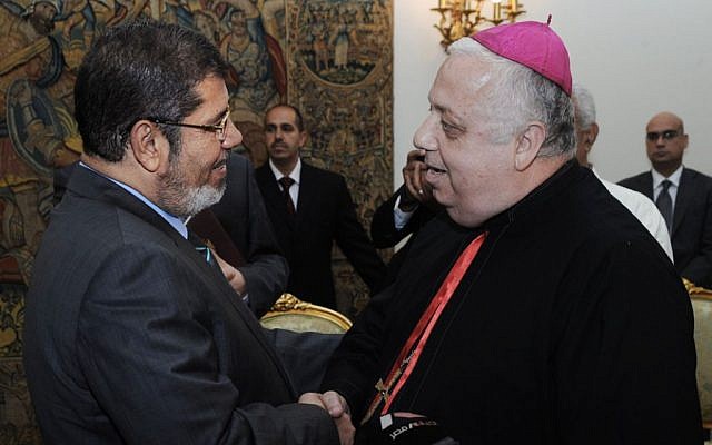 President-elect Morsi meets with Christian leaders in Cairo Wednesday (photo credit: AP Photo/Mohammed Abd El-Maaty) President-elect Morsi meets with Christian leaders in Cairo Wednesday (photo credit: AP Photo/Mohammed Abd El-Maaty)
