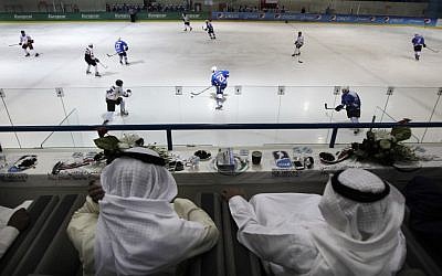 Emirati and Kuwaiti officials watch a hockey match between Oman and Kuwait in Abu Dhabi, United Arab Emirates (photo credit: AP/Kamran Jebreili)