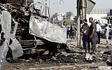 The scene of a car bomb attack in the Karrada neighborhood of Baghdad, June 13 (photo credit: AP Photo/Karim Kadim)