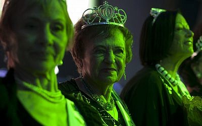 Holocaust survivors participate in a beauty pageant in Haifa on Thursday, June 28, 2012. (photo credit: Sebastian Scheiner/AP)