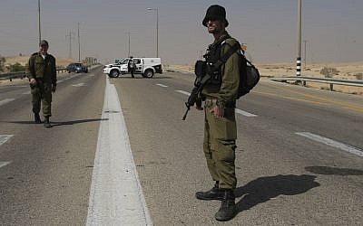 Israeli troops guarding the area near the attack. (photo credit: AP/Tsafrir Abayov)