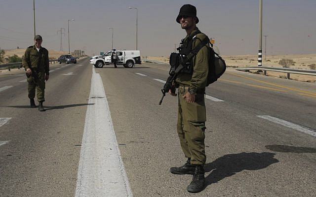 Israeli troops guarding the area near the attack. (photo credit: AP/Tsafrir Abayov)