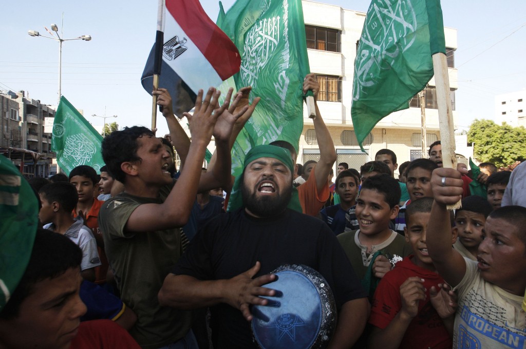 Celebrating the victory in Gaza. (photo credit: AP/Hatem Moussa)