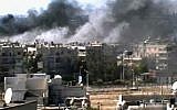 Image capture of explosions in Homs on Monday (photo credit: Bambuser/Homslive via AP video)