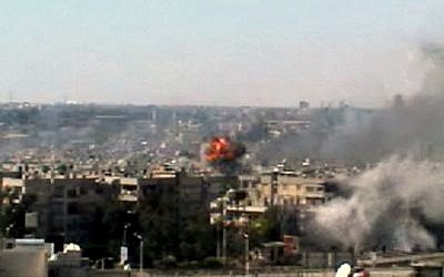 A series of explosions rocked the central Syrian city of Homs on June 13. (photo credit: Bambuser/Homslive/AP)