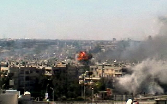 A series of explosions rocked the central Syrian city of Homs on June 13. (photo credit: Bambuser/Homslive/AP)