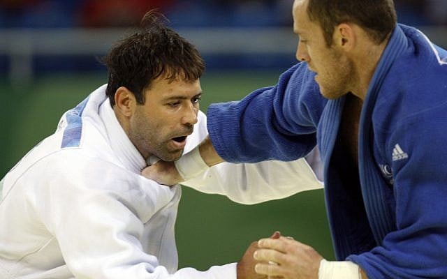 Arik Zeevi, white, and France's Frederic Demontfaucon compete at the men's judo -100kg half heavyweight division preliminaries at the Beijing 2008 Olympics (photo credit: AP/Charles Dharapak) Arik Zeevi, white, and France's Frederic Demontfaucon compete at the men's judo -100kg half heavyweight division preliminaries at the Beijing 2008 Olympics (photo credit: AP/Charles Dharapak)