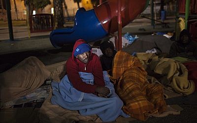 Homeless men sleep outside in Levinsky Park, Tel Aviv. (photo credit: Tamir Kalifa)