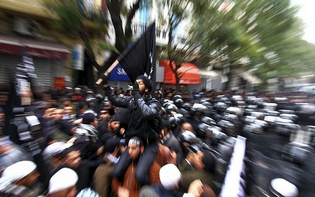 Tunisian Salafists confront police officers during a demonstration in Tunis in February. (photo credit: AP/Amine Landoulsi, File) Tunisian Salafists confront police officers during a demonstration in Tunis in February. (photo credit: AP/Amine Landoulsi, File)