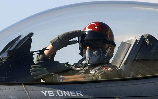 A Turkish pilot salutes before take-off at an air base in Konya, Turkey (photo credit: AP)