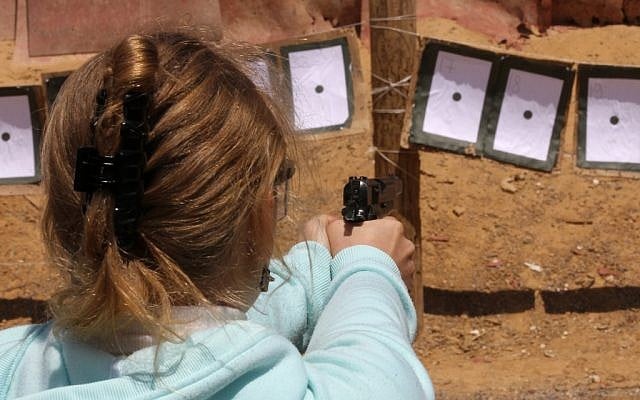 A girl shooting a pistol at a shooting range in Gush Etzion in 2010 (photo credit: Nati Shohat/Flash90