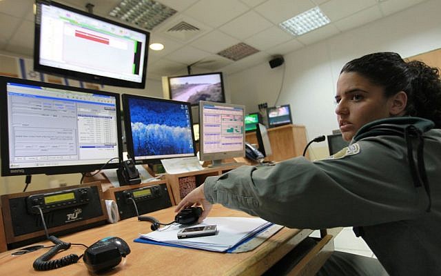 Illustrative. An Israeli soldier in front of computer monitors. (Nati Shohat/Flash90)