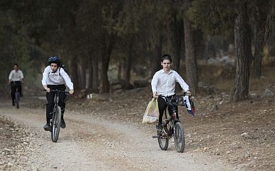 Young orthodox Jewish boys ride their bicycles in the forest near Modi'in Illit. (Nati Shohat/FLASH90)