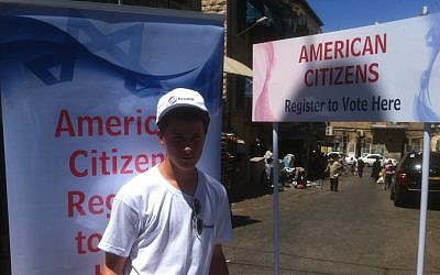 A volunteer signing up US citizens to vote on the streets of Jerusalem (photo credit: courtesy Elie Pieprz) A volunteer signing up US citizens to vote on the streets of Jerusalem (photo credit: courtesy Elie Pieprz)