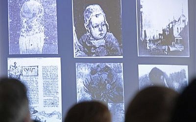 People look at a display of looted art on a video screen as they attend the Provenance Research Training Program to the Nazi-looted art, in Magdeburg, central Germany, Thursday, June 14, 2012. (photo: AP /Jens Meyer)