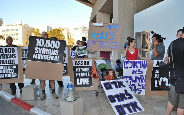 A demonstration against Vladimir Putin and Syria outside the Hilton hotel in Tel Aviv Tuesday. (photo credit: Artiom Degel/courtesy A demonstration against Vladimir Putin and Syria outside the Hilton hotel in Tel Aviv Tuesday. (photo credit: Artiom Degel/courtesy