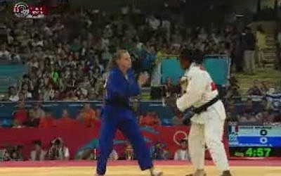 Israeli judoka Alice Schlesinger (blue) was eliminated from Olympic competition on Tuesday (photo credit: screen capture iba.org.il)