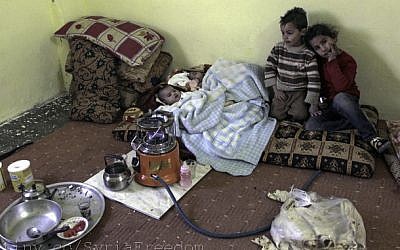 Syrian refugee children at a camp in Mafraq, near Jordan's northern border with Syria, in February (photo credit: CC-BY FreedomHouse, Flickr)