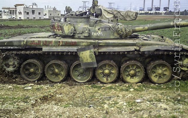 A destoryed Syrian Army tank. Russia has indicated it will not provide Assad with any new weapons. (photo credit: CC BY/FreedomHouse,Flickr)
