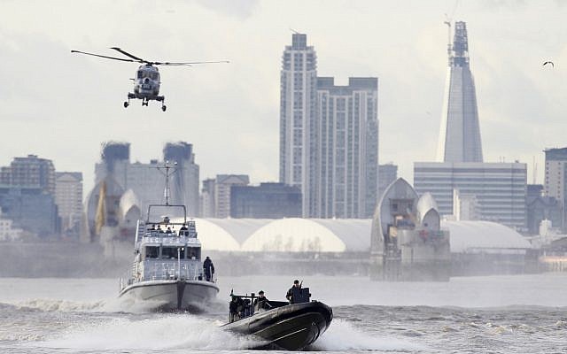British police and military forces teamed up Thursday using a helicopter and inflatable boats to practice security procedures designed to protect the Thames river from possible terrorist attacks during the 2012 London Olympics. (photo credit: AP/Alastair Grant) British police and military forces teamed up Thursday using a helicopter and inflatable boats to practice security procedures designed to protect the Thames river from possible terrorist attacks during the 2012 London Olympics. (photo credit: AP/Alastair Grant)