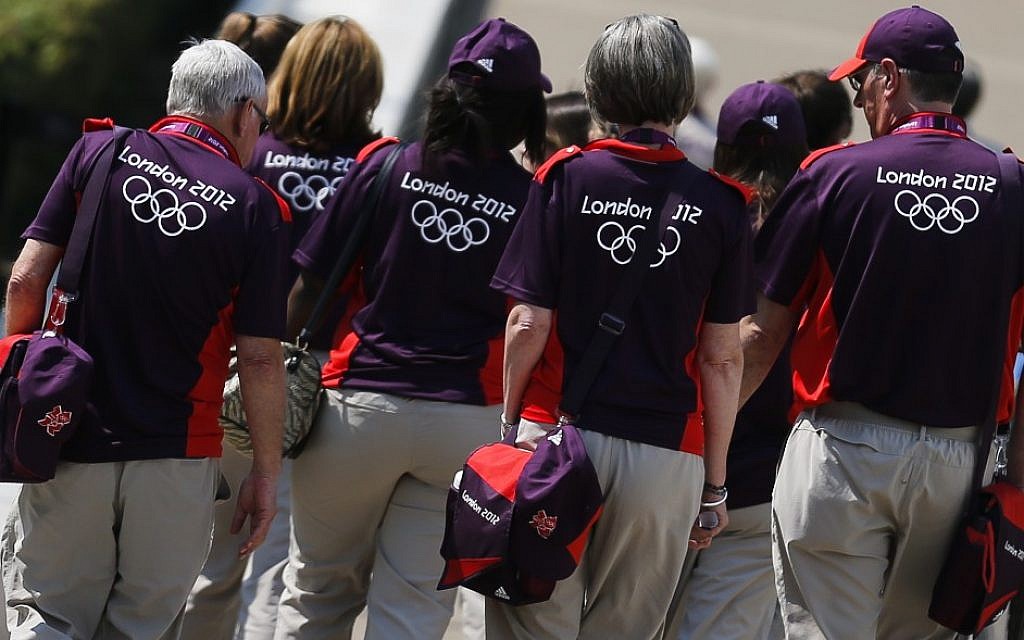 Volunteers arrive at Greenwich Park, the site for the equestrian and modern pentathlon events at the 2012 Summer Olympics, Wednesday, July 25, 2012, in London. (photo credit: AP Photo/Markus Schreiber) Volunteers arrive at Greenwich Park, the site for the equestrian and modern pentathlon events at the 2012 Summer Olympics, Wednesday, July 25, 2012, in London. (photo credit: AP Photo/Markus Schreiber)