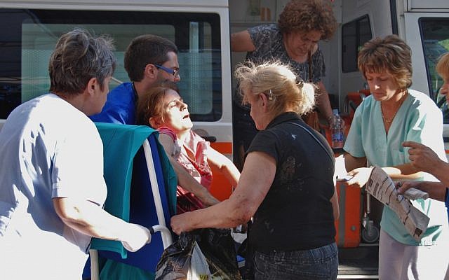 An unidentified injured Israeli tourist is carried in front of a Burgas hospital on Wednesday (photo credit: AP/ Bulphoto Agency) An unidentified injured Israeli tourist is carried in front of a Burgas hospital on Wednesday (photo credit: AP/ Bulphoto Agency)