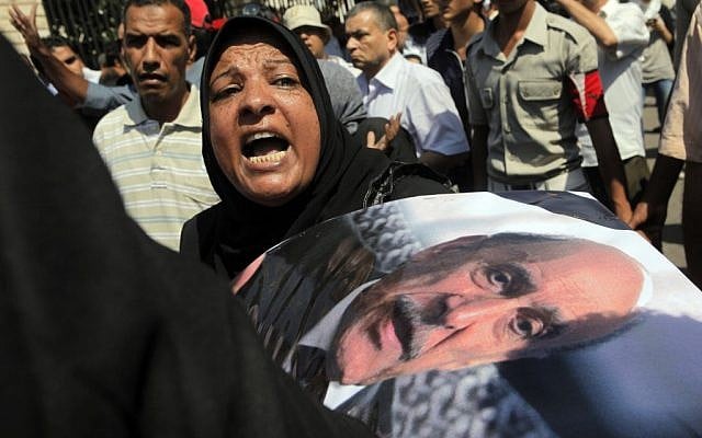 An Egyptian woman mourns Omar Suleiman at his funeral Friday (photo credit: AP Photo/Amr Nabil)