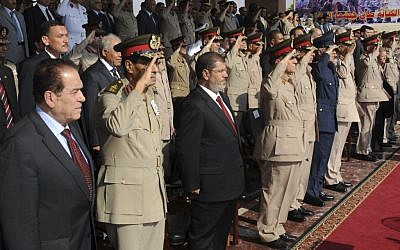 Mohammed Morsi stands amid soldiers in his inauguration ceremony June 30 (photo credit: AP Photo/Egyptian Presidency)