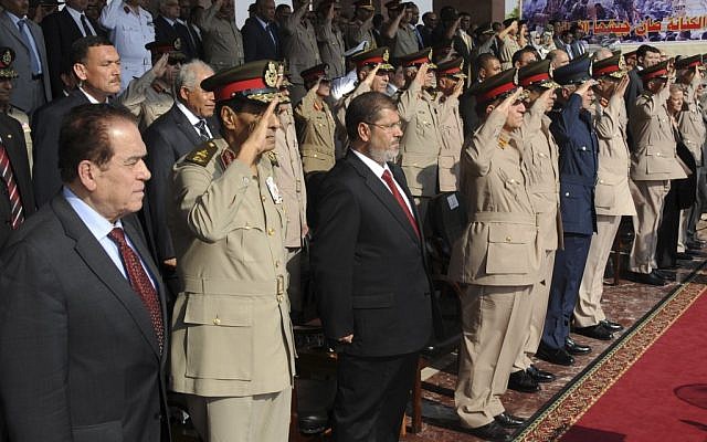 Mohammed Morsi stands amid soldiers in his inauguration ceremony June 30 (photo credit: AP Photo/Egyptian Presidency) Mohammed Morsi stands amid soldiers in his inauguration ceremony June 30 (photo credit: AP Photo/Egyptian Presidency)