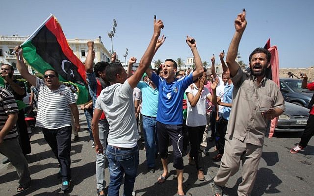 Libyans celebrate in Martyrs' Square in Tripoli after voting in the first democratic election in decades in July (photo credit: AP/Abdel Magid Al Fergany) Libyans celebrate in Martyrs' Square in Tripoli after voting in the first democratic election in decades in July (photo credit: AP/Abdel Magid Al Fergany)