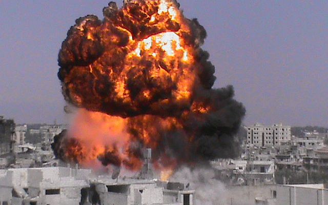 A fireball purportedly in Homs, Syria in an image provided Sunday. (photo credit: AP/Shaam News Network, SNN) A fireball purportedly in Homs, Syria in an image provided Sunday. (photo credit: AP/Shaam News Network, SNN)