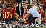 Children brought onto the pitch surround Spain's Fernando Torres after his team's 4-0 victory at the Euro 2012 soccer final on Sunday. (photo credit: AP/Ivan Sekretarev)