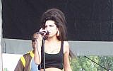 Amy Winehouse in concert, August 2007 (photo credit: CC BY-SA 3.0, by Massic80, Wikimedia Commons)