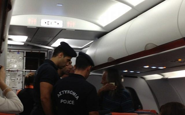 Israeli man being removed from EasyJet flight by Cypriot police in Paphos. (photo credit: @marcusdysch, Twitter)