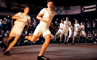 This photo released by the Gielgud Theatre, London on Thursday July 12, shows Jack Lowden as Eric Liddell, left, and James McArdle as Harold Abrahams in the Gielgud Theatre production of Chariots of Fire. (photo credit: AP/Hugo Glendenning, Gielgud Theatre)