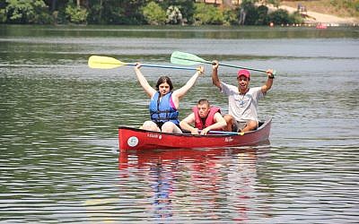 Canoers in the Tikvah program at Camp Ramah in Palmer, Massachusetts, which accommodates youngsters with special needs. (photo credit: Camp Ramah/JTA)