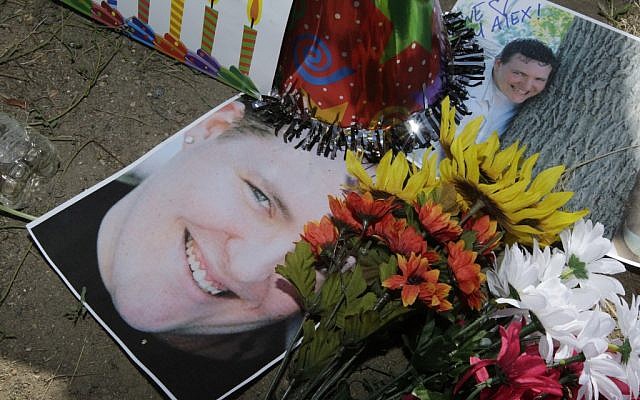 A memorial for Alex Sullivan, killed when a gunman stormed a Colorado movie theater on Friday. (photo credit: AP/Ted S. Warren)