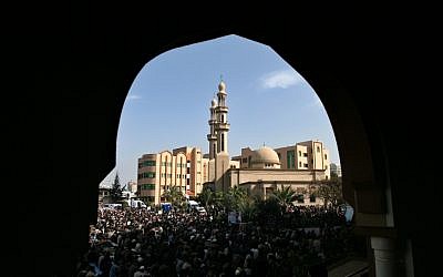 Palestinian Hamas supporters attend Friday prayer at the Islamic University in Gaza (photo credit: Wissam Nassar/Flash90)