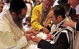 Illustrative photo of Jews performing a religious circumcision. (Serge Attal/Flash90)