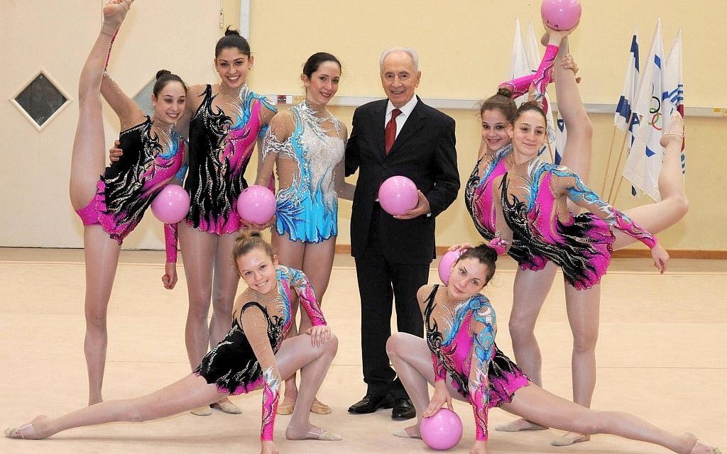 Shimon Peres and Israel's Rhythmic Gymnastics team, January 2012 (photo credit: Mark Nayman/Flash90)