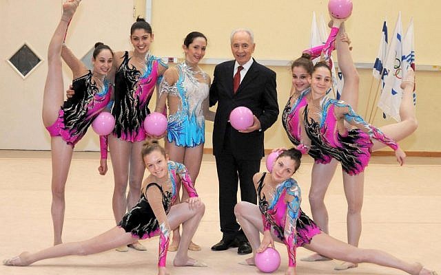 Shimon Peres and Israel's Rhythmic Gymnastics team, January 2012 (photo credit: Mark Nayman/Flash90)