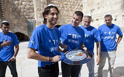 Hapoel Ironi Kiryat Shmona soccer players visit the Western Wall in Jerusalem after winning the national championship in April, 2012. (photo credit: Yonatan Sindel/Flash90)