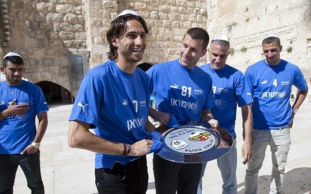 Hapoel Ironi Kiryat Shmona soccer players visit the Western Wall in Jerusalem after winning the national championship in April, 2012. (photo credit: Yonatan Sindel/Flash90) Hapoel Ironi Kiryat Shmona soccer players visit the Western Wall in Jerusalem after winning the national championship in April, 2012. (photo credit: Yonatan Sindel/Flash90)