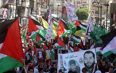 Hamas supporters hold a rally in the West Bank city of Ramallah in May (photo credit: Issam Rimawi/Flash 90)