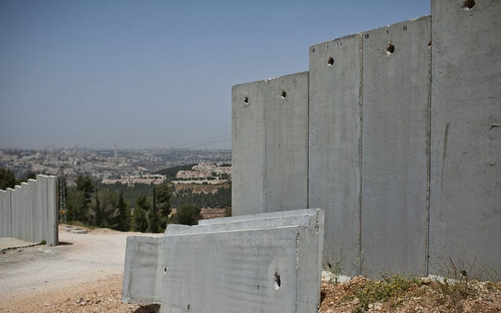 A portion of the security barrier, which largely separates the West Bank from Israel, under construction near Jerusalem. (Noam Moskowitz/Flash90) A portion of the security barrier, which largely separates the West Bank from Israel, under construction near Jerusalem. (Noam Moskowitz/Flash90)