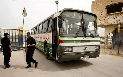 A Palestinian bus enters Egypt from the Gaza Strip, May 27 (photo credit: A Palestinian woman at the Rafah Border Crossing, May 27 (photo credit: Abed Rahim Khatib / Flash 90)